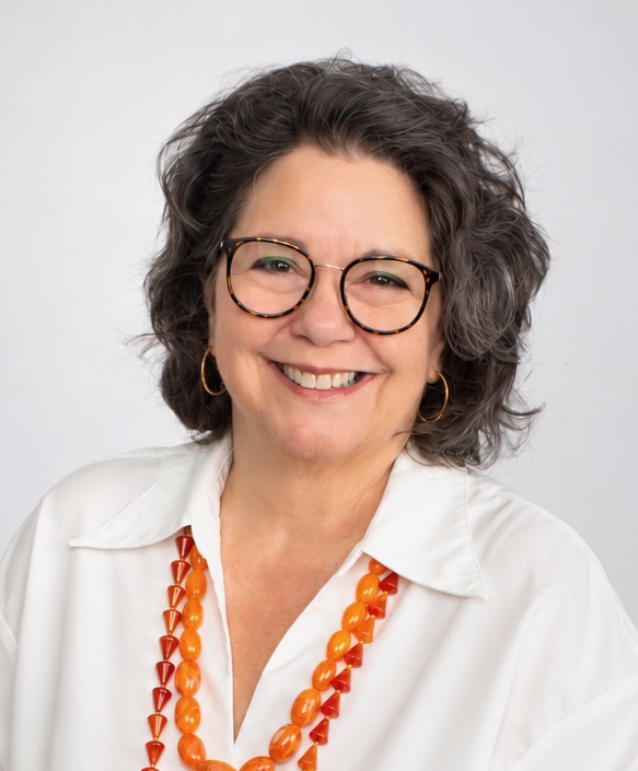 Brunette 65 year old woman.